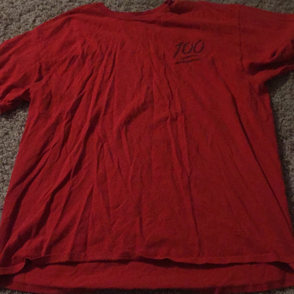 A red “keeping it 100” shirt
